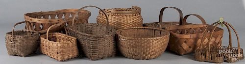 Nine assorted woven baskets.