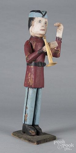 Carved and painted figure of a bugle boy