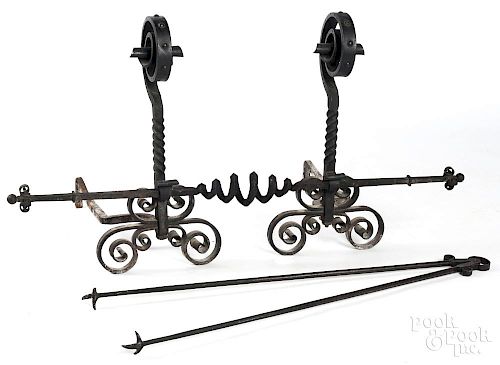 Pair of Arts and Crafts iron andirons, 27'' h.