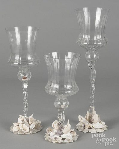 Three oversize colorless glass goblets