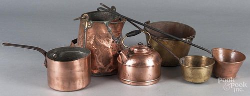 Group of brass and copper cookware.