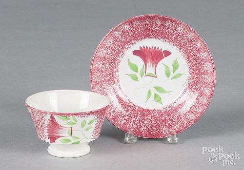 Red spatter thistle cup and saucer.