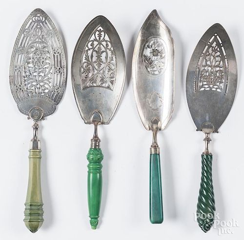 Four English silver reticulated serving utensils,