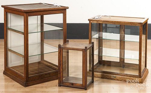 Three glass and oak display cases