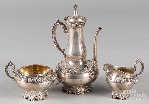 Sterling silver repousse three- piece tea service