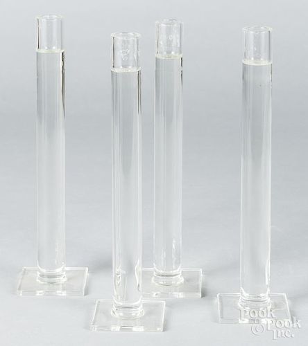 Set of four Shea glass candlesticks