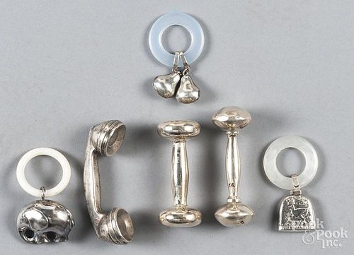 Six silver childrens rattles.