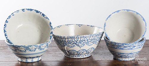 Five blue spongeware mixing bowls, largest - 6'' h.
