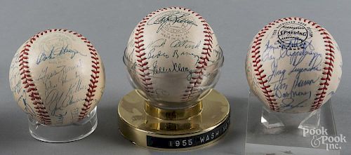 Three signed team baseballs