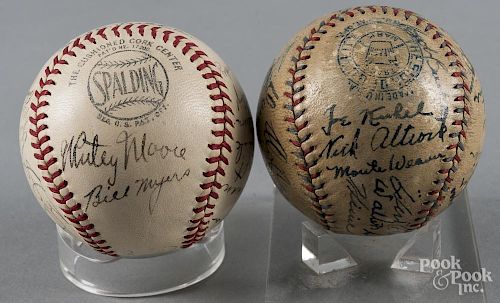 Two signed team baseballs