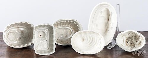 Six white Ironstone food molds.