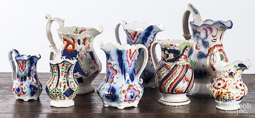 Eight Gaudy Welsh pitchers, tallest - 9 1/2''.