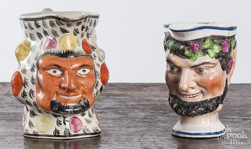 Two Staffordshire satyre pitchers