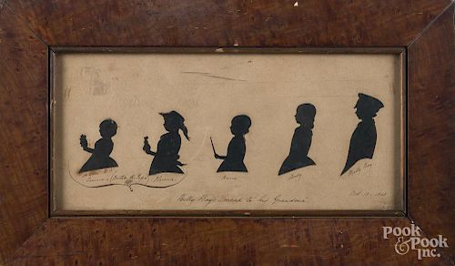 Hollowcut silhouette of five siblings