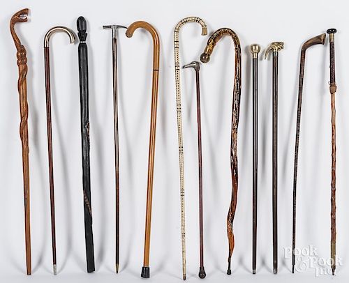 Twelve walking sticks/canes