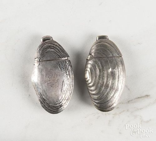 Two figural clam shell match vesta safes