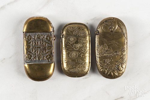 Three Japanese embossed brass match vesta safes