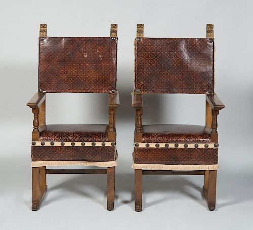 PAIR OF SPANISH BAROQUE STYLE WALNUT AND PARCEL-GILT HALL CHAIRS