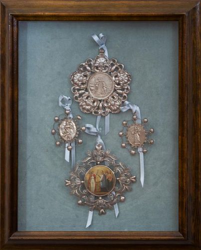FOUR MOUNTED MEDALLIONS IN A SHADOWBOX CASE