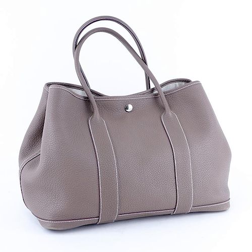 Hermes Etoupe Garden Party 36 Bag. Ivory herringbone fabric interior with zipper and patch pockets, snap closure.