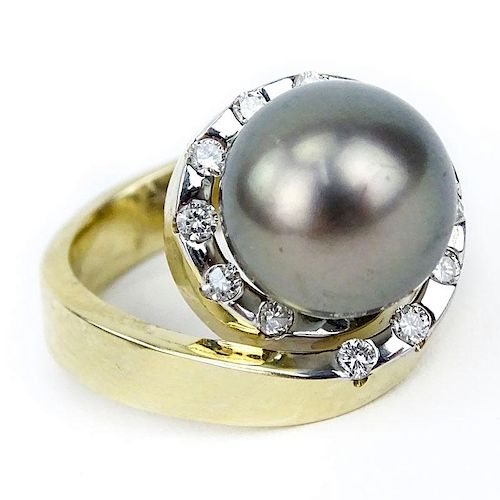 Approx. .65 Round Brilliant Cut Diamond, 11mm Tahitian Black Pearl, 14 Karat Yellow Gold Retro Style Ring.
