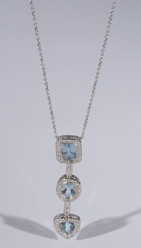 Ladies 14 karat white gold aquamarine pendent consisting of one 8x6mm emerald cut aqua surrounded by eight melee diamonds, on