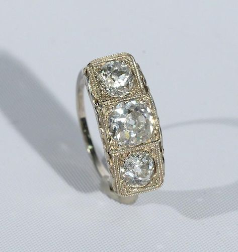Gold or platinum ring set with three diamonds, center diamond approximately 1.50cts.-1.60cts. flanked by diamonds at .60cts.-