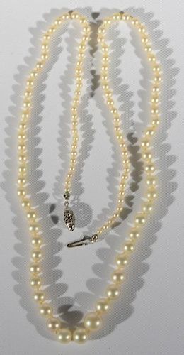 String of graduated cultured pearls with 14 karat white gold clasp. lg. 19 1/2in.
