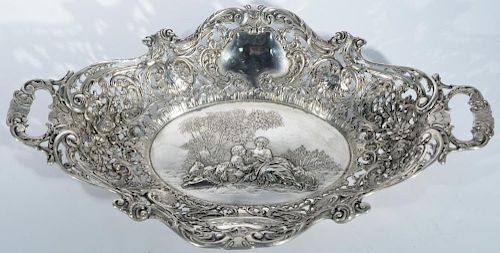 Continental silver oval reticulated bowl with open work handles and center with romantic scene