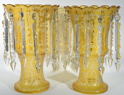 Pair of Bohemian glass lusters with prisms, amber to clear. ht. 15in., wd. 11in. Provenance: Property from the Estate of Fran