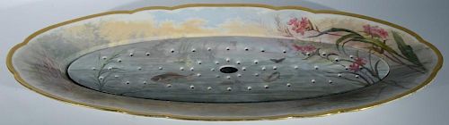 Limoges fish platter with reticulated liner. lg. 26in. Provenance: Property from the Estate of Frank Perrotti Jr. of Hamden,