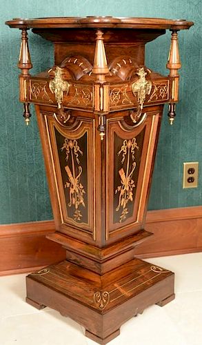 Renaissance Revival rosewood pedestal having shaped top supported by turned columns on tapering square base with metal mounts