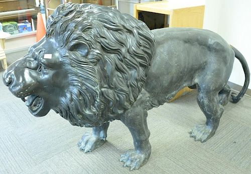 Pair bronze life size male lions with full manes (one tail repaired)