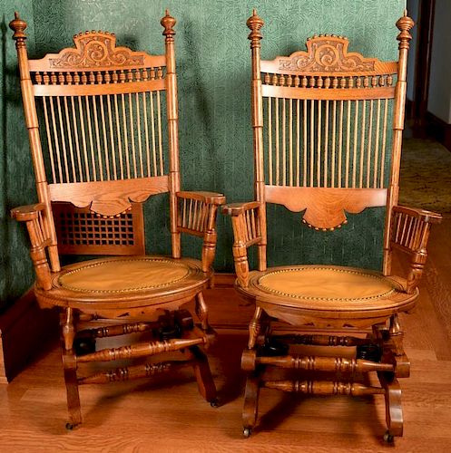 Pair of oak platform rockers with leather seats. ht. 45in. Provenance: Property from the Estate of Frank Perrotti Jr. of Hamd