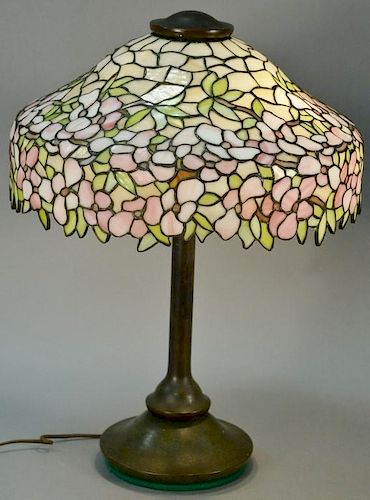 Attributed to Handel, leaded glass table lamp on bronze base, dogwood pattern with pink and white flowers, and yellow and gre