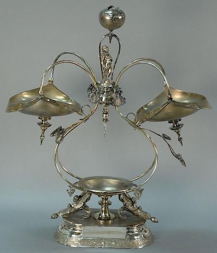 Victorian silver plate figural epergne mounted with putti. ht. 28in. Provenance: Property from the Estate of Frank Perrotti J