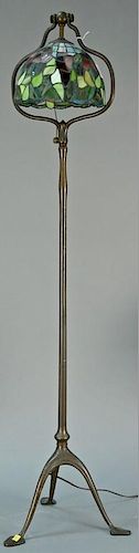 Tiffany Studios N.Y. bronze floor lamp for bell shaped shade on plain shaft ending in tripod base with flat shaped feet (shad