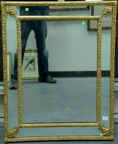 Continental mirror having gilt and gessoed frame inside a frame supported by woman's faces, probably 18th century. 39" x 31"