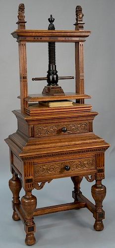 Oak book press having two carved lions over press over drawer on base with drawer set on Jacobean style base with H stretcher