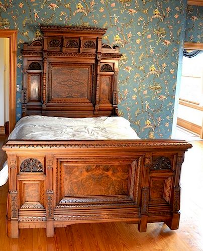 Two piece Victorian walnut bedroom set to include bed having three dimensional carved panels along with burlwood recessed pan