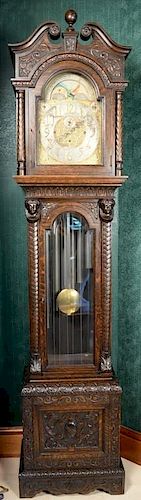 Carved oak tall case clock having Elliot type brass works and moon phase dial marked Udall & Ballou, case with carved broken