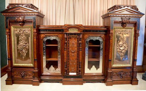 Renaissance Revival walnut, burl walnut, and ebonized wood cabinet having central bronze plaque over carved panel with inlaid