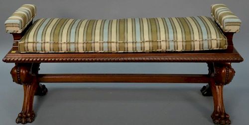 Carved walnut Victorian bench with upholstered cushion top on large paw feet. ht. 23in., wd. 48in., dp. 17 1/2in.