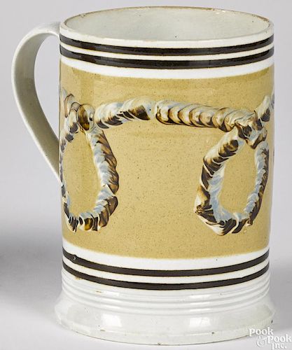 Mocha mug with earthworm decoration