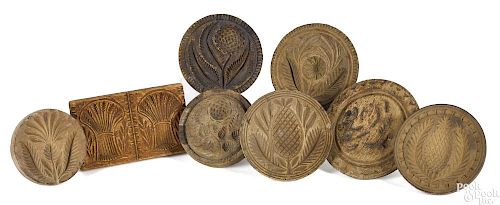 Eight turned and carved butterprints