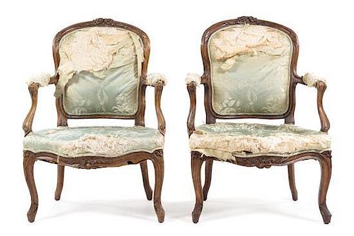 A Pair of Louis XV Carved Beechwood Fauteuils Height 37 inches.