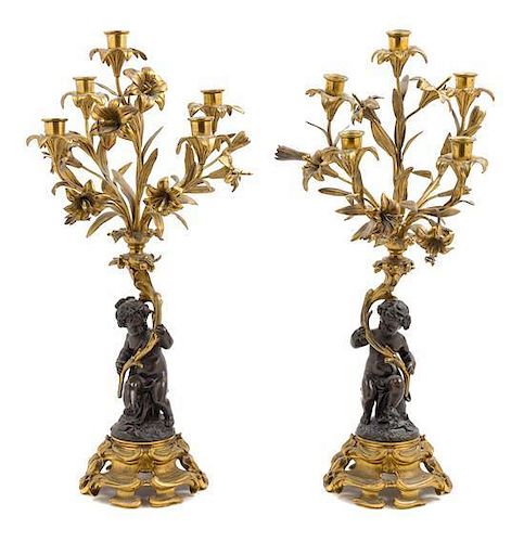 * A Pair of Louis XV Style Gilt and Patinated Bronze Figural Five-Light Candelabra Height 24 1/2 inches.