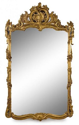 A Large Louis XV Style Giltwood Mirror Height 104 x width 62 1/2 inches.