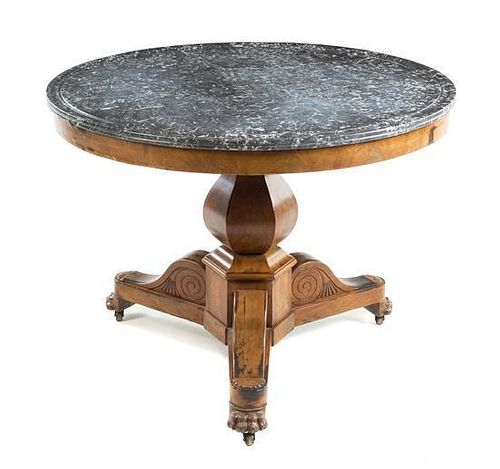 A Louis Philippe Burlwood Center Table Height 28 3/4 x diameter of top 38 1/4 inches.