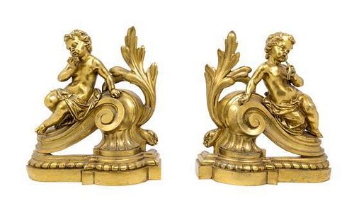 A Pair of French Gilt Metal Chenets Height 11 1/4 inches.